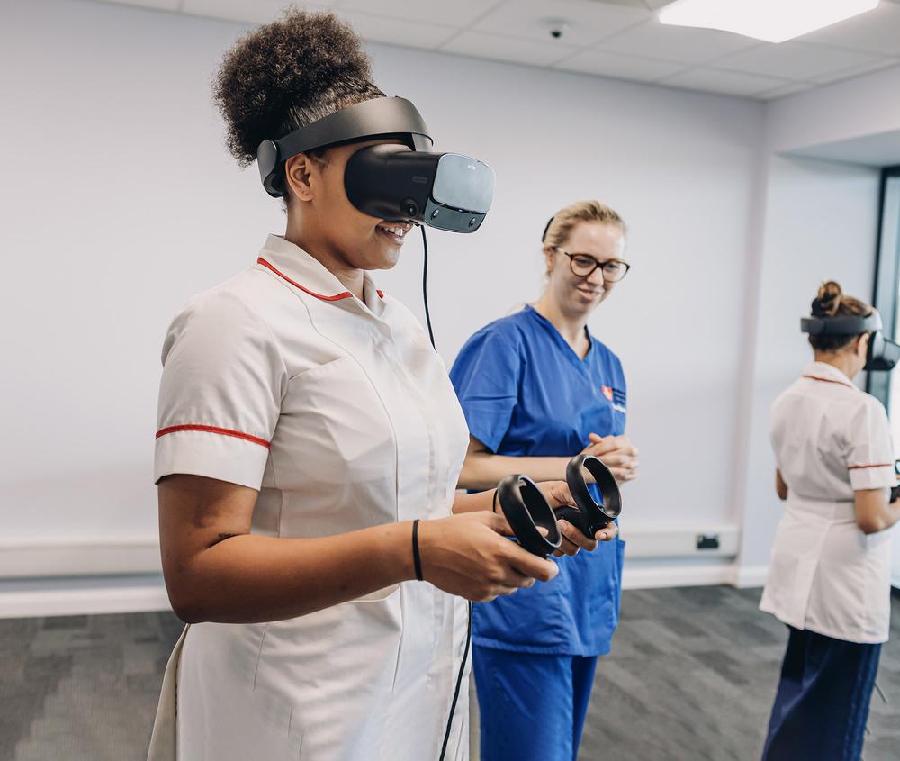 student nurse with VR headset with screen in background