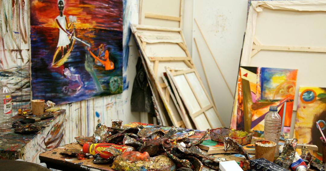 studio with colourful paintings and equipment