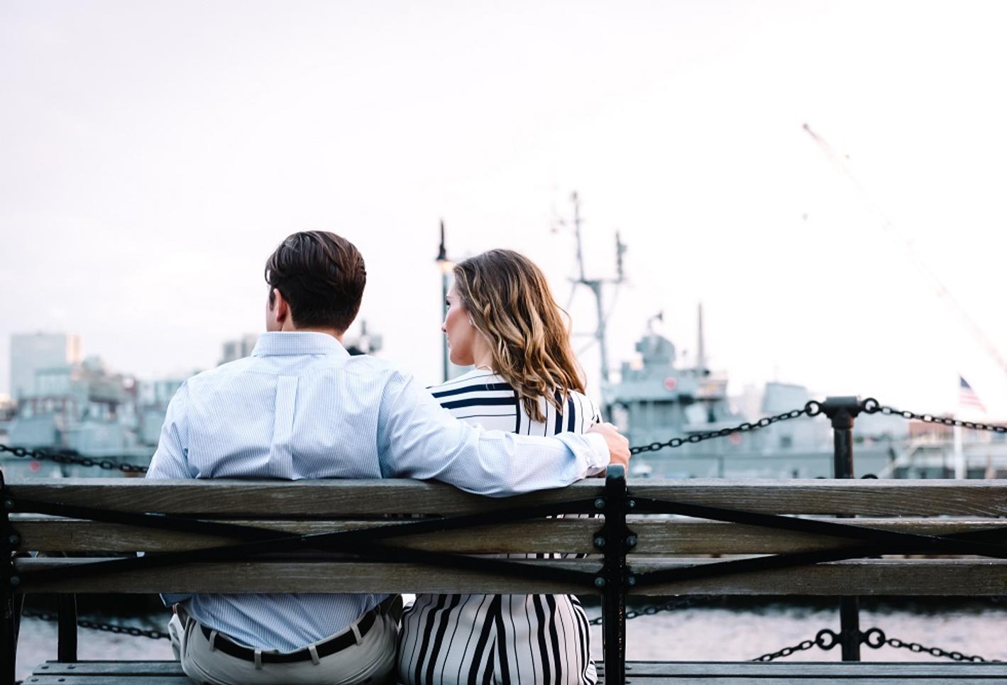 A couple sitting on a bench