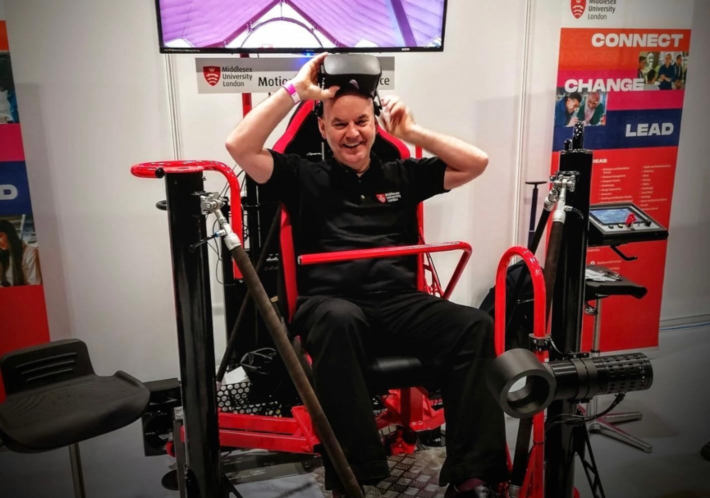 Member of staff on VR rollercoaster.