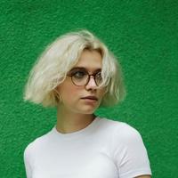 Person in front of a green background
