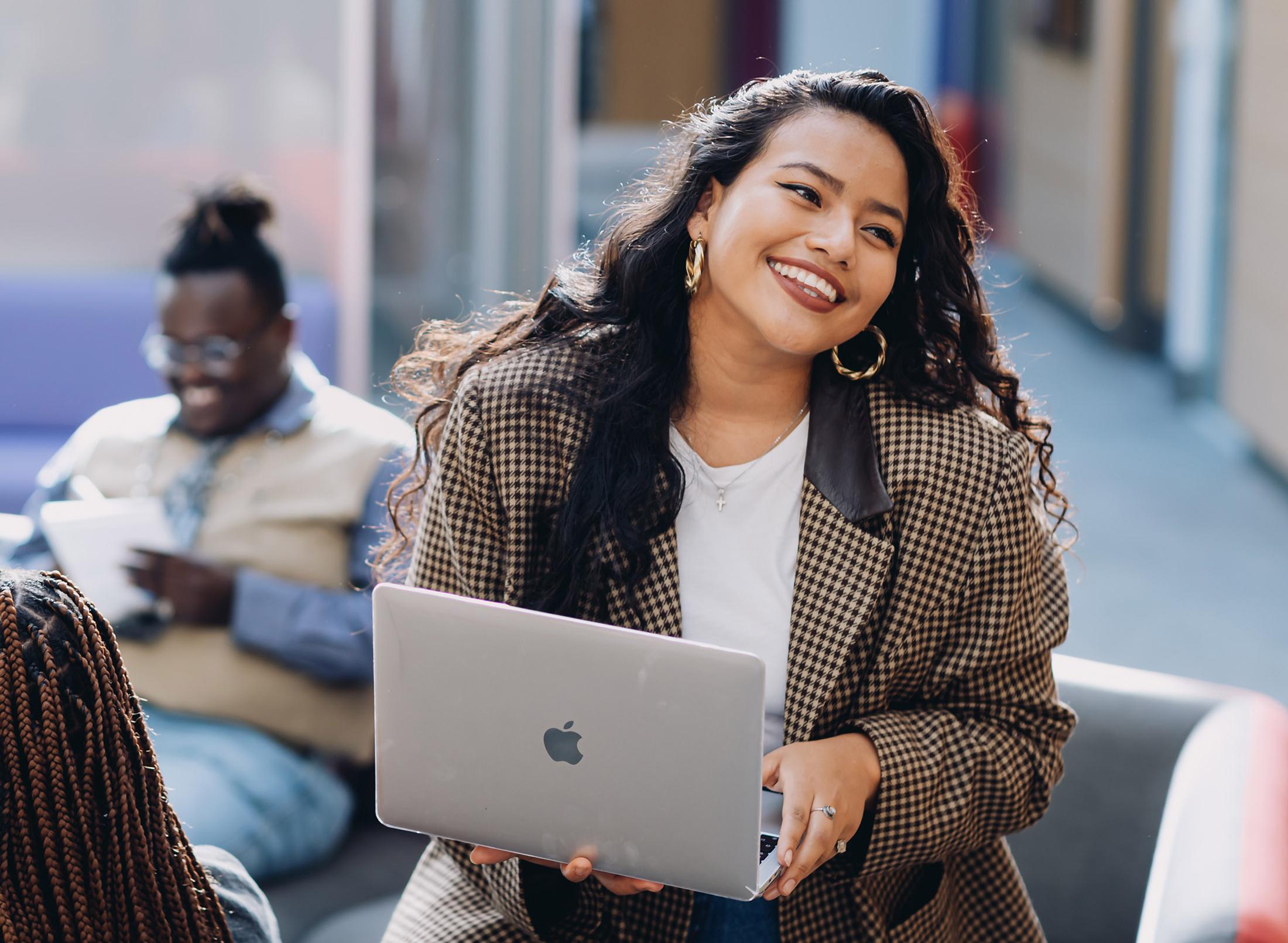 happy student with laptop