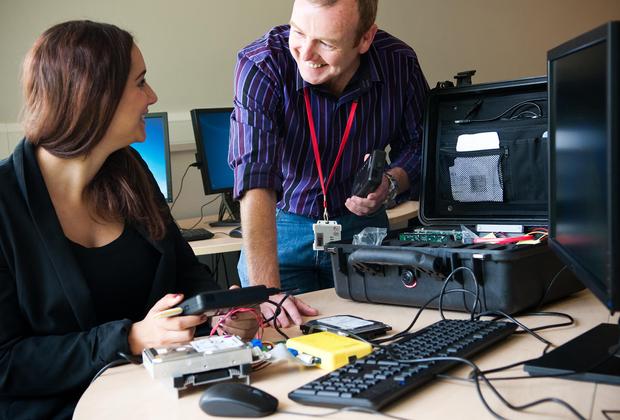 Student working with lecturer on computer