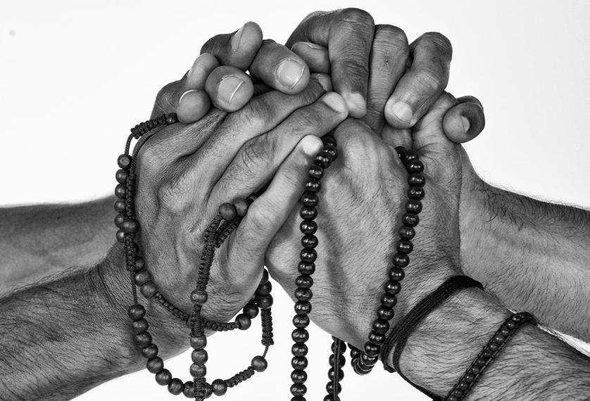 Two people join hands